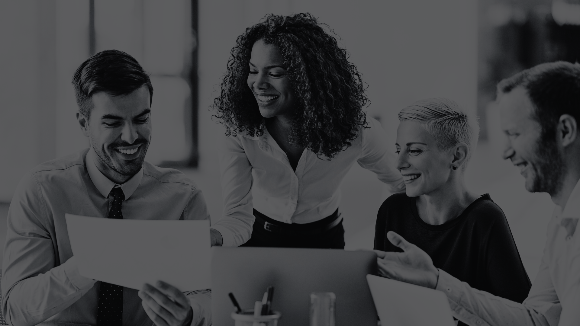 Business People looking at papers smiling  
